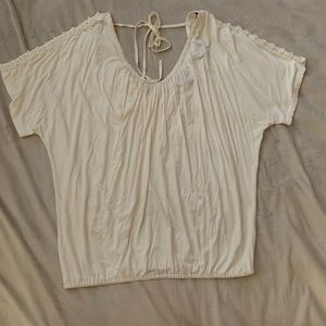 Cream V-neck blouse with pearl beading